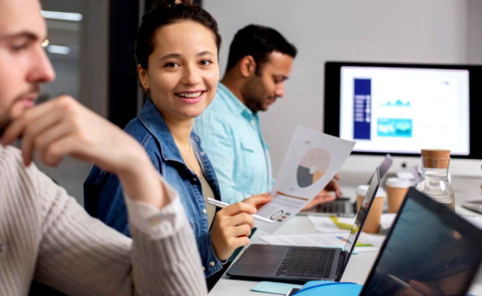 Students participating in investment workshop analyzing real market data