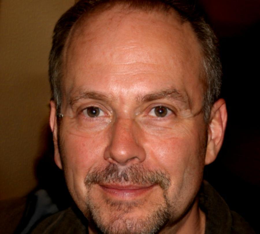 Kenneth Bromwell, lead instructor reviewing market charts